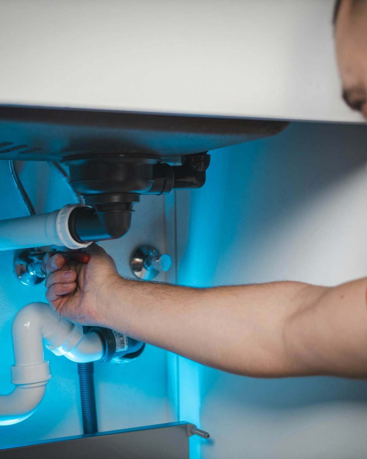 Plumber repairing a pipe