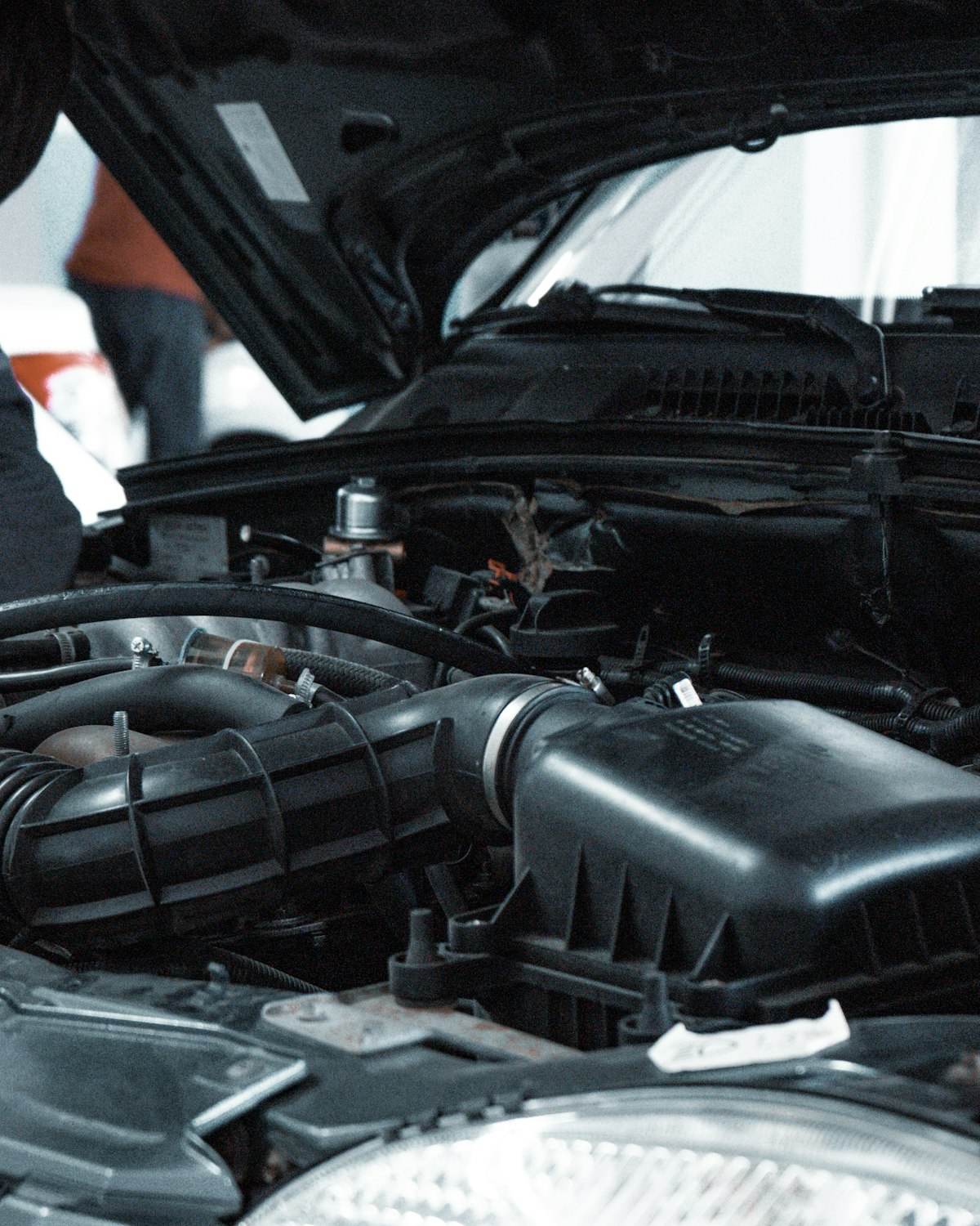 Mechanic inspecting a car engine